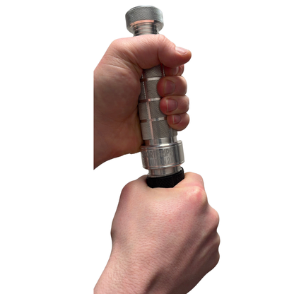 Hand holding a metallic tool with a white background