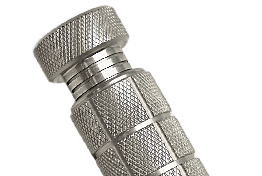 Close-up of the resistance adjustment knob on the SportGrips REVOLUTION 2.0, showing precision knurling and anodized aluminum finish